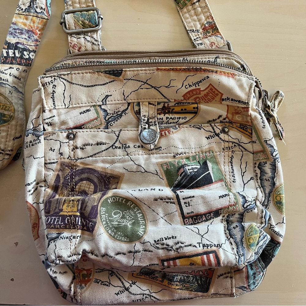 Fossil world traveler purse. Can be worn as crossbody. So many pockets!